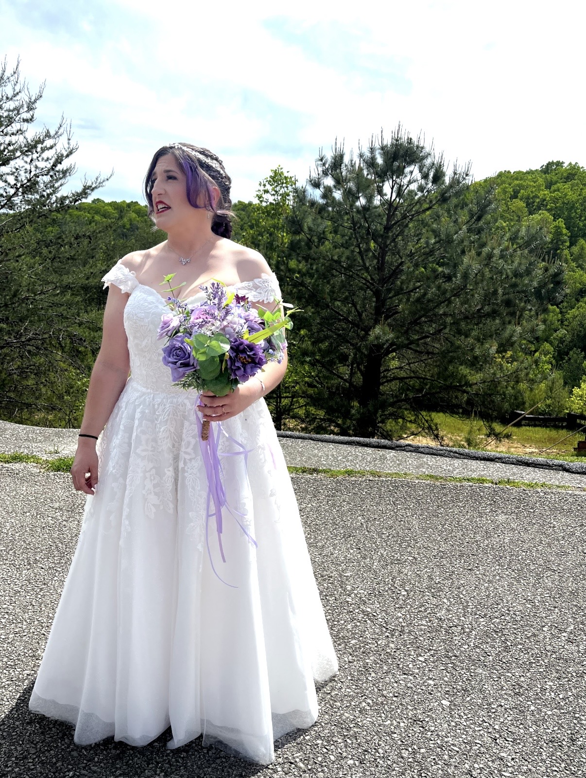 Aimée Szetela on her wedding day holding a bouquet